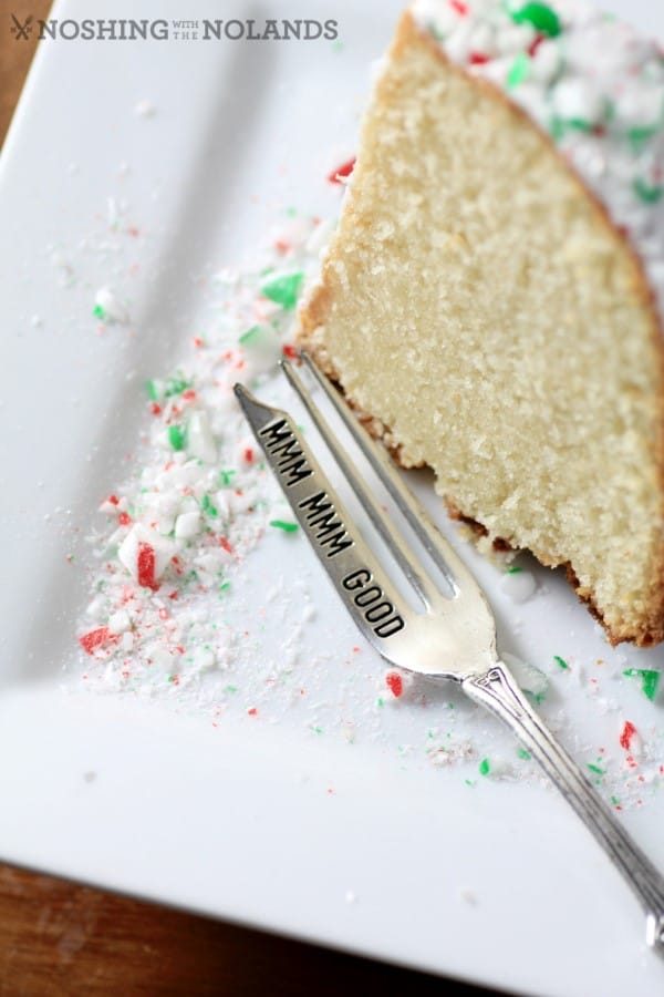 White Hot Chocolate Peppermint Bundt slice on a white plate with a fork