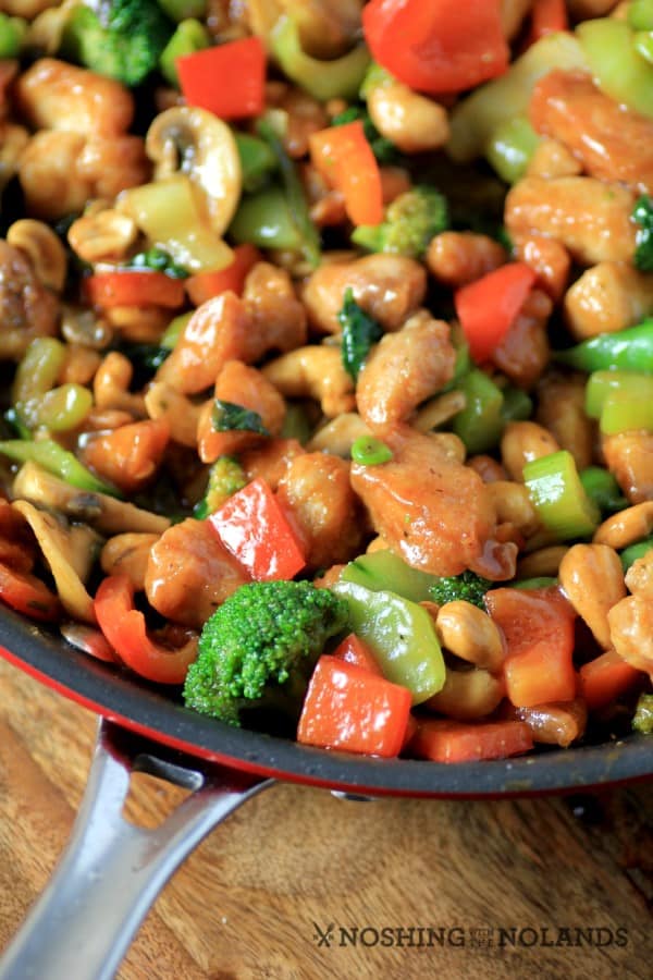 Asian Skillet Stir Fry in a red skillet on a wooden board