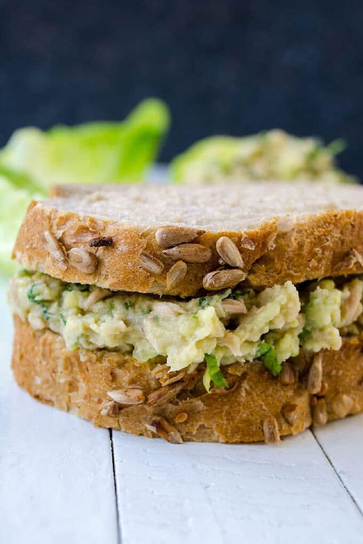 Get outside and enjoy the day with these 50 Picnic Basket Essentials. There is something for everyone to pack the perfect picnic and enjoy family time and the great outdoors. Close-up of an Avocado Tuna Sandwich.
