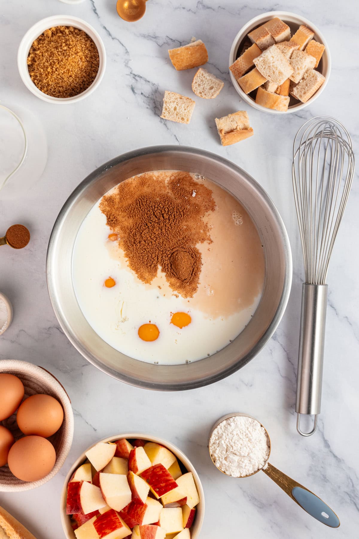 Mixing eggs, brown sugar, vanilla extract, ground cinnamon and salt in a large bowl.