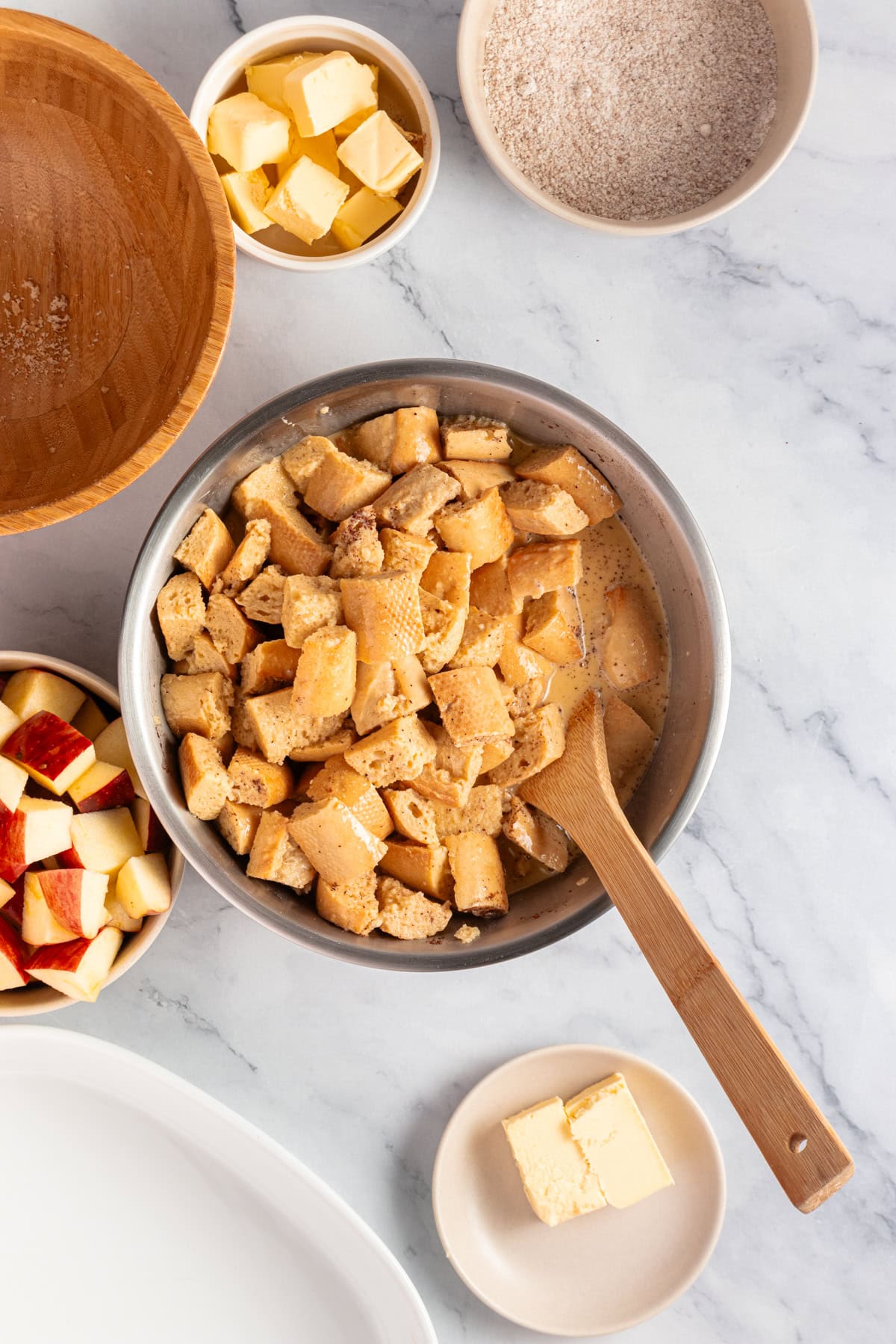 Stir the bread cubes into the egg custard mixture.