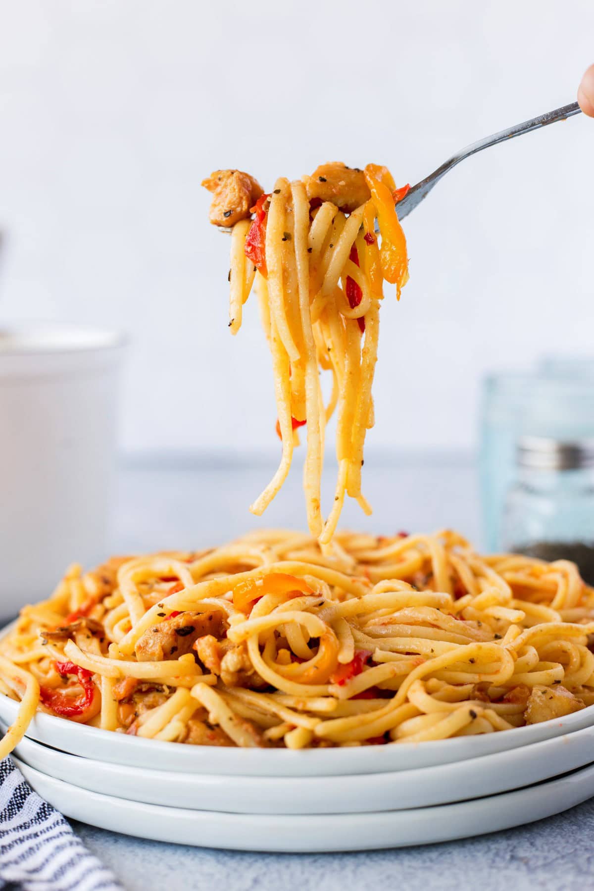 Taking a forkful of Garlic Chicken Pasta. 