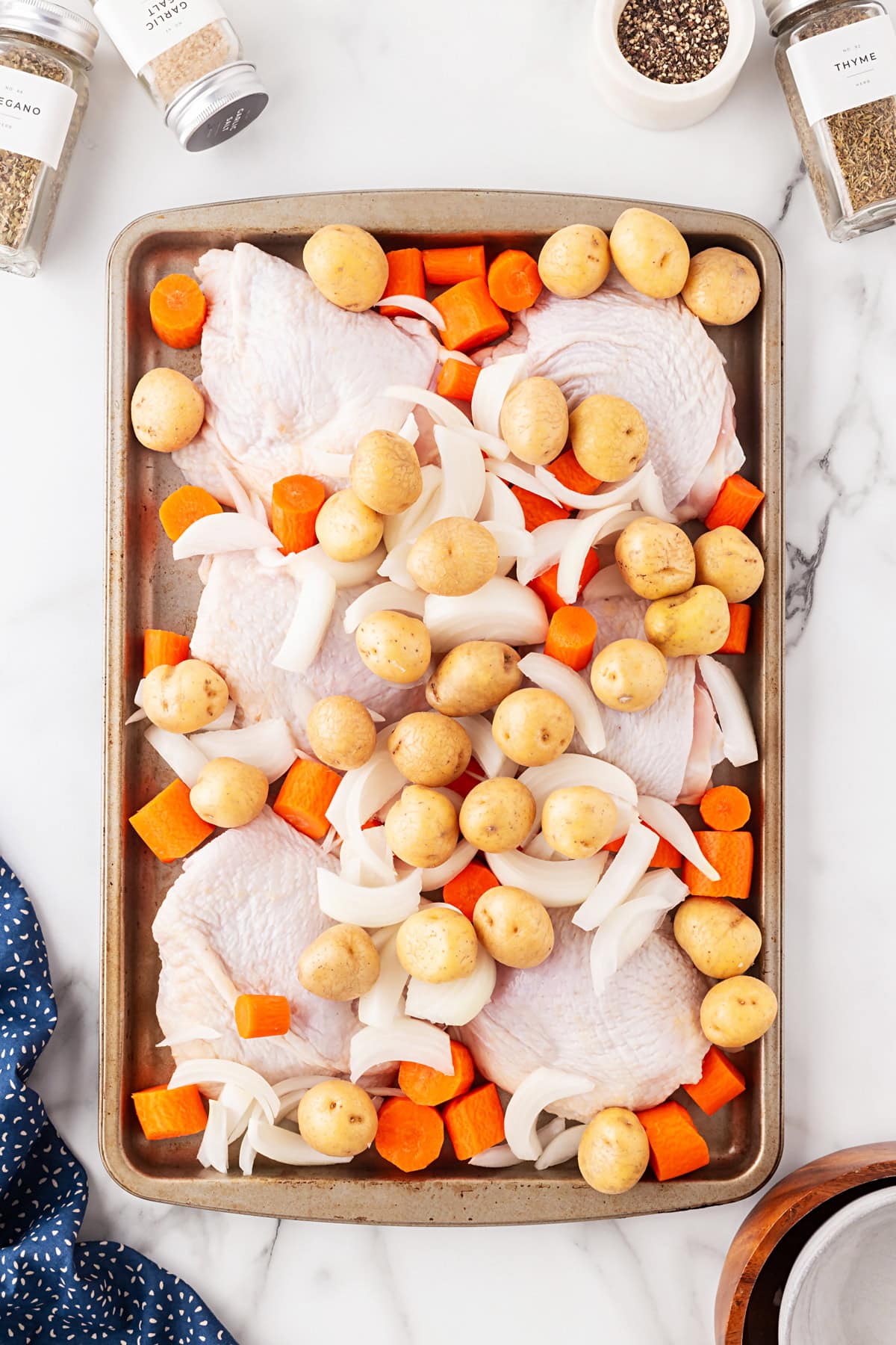 Ingredients tossed onto a sheet pan. 