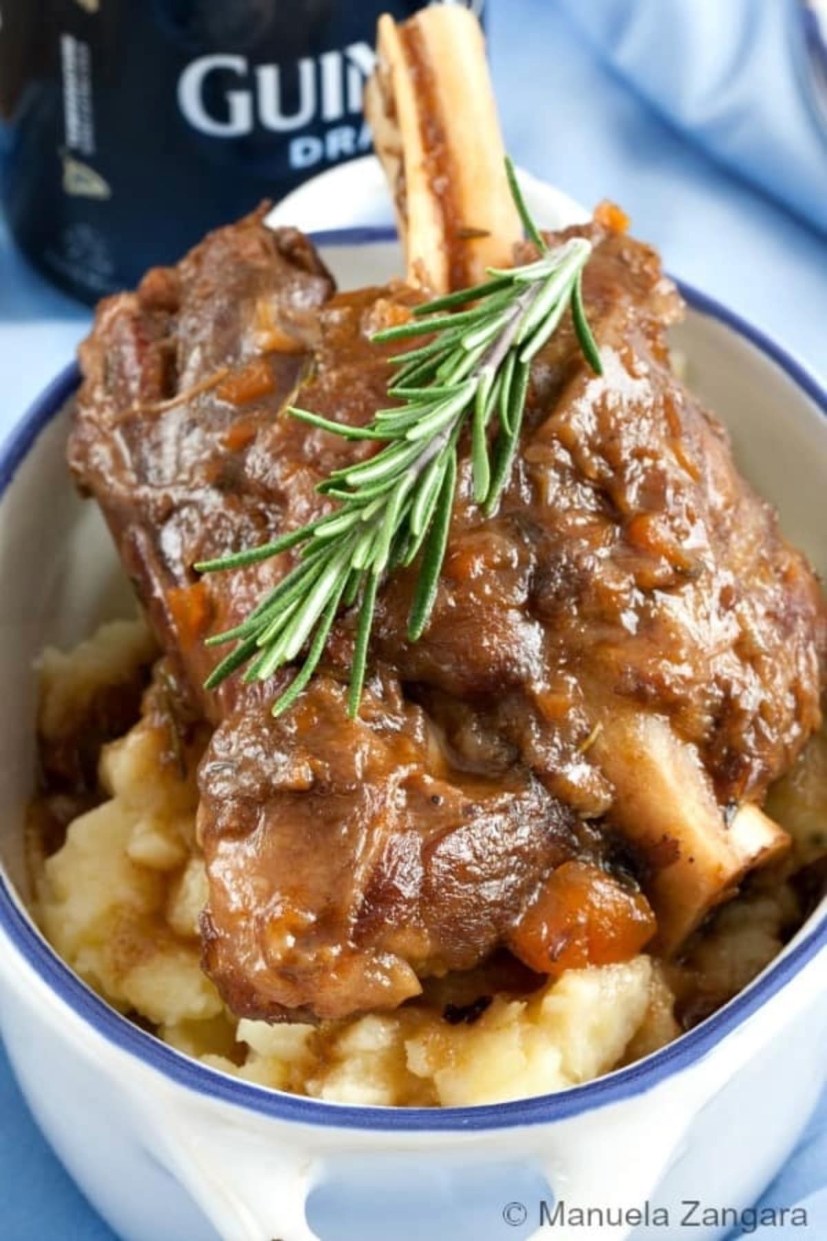 Guinness Braised Lamb Shanks in a bowl with parsley. 