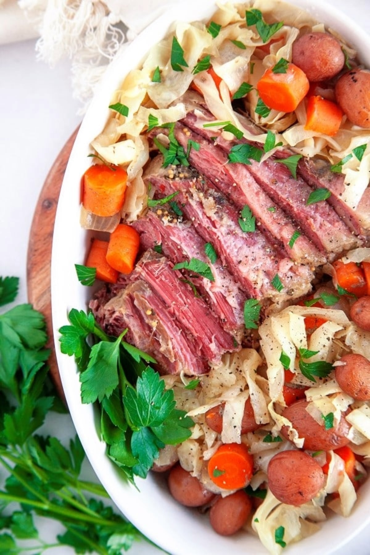 Slow Cooker Corned Beef and Cabbage served with vegetables.