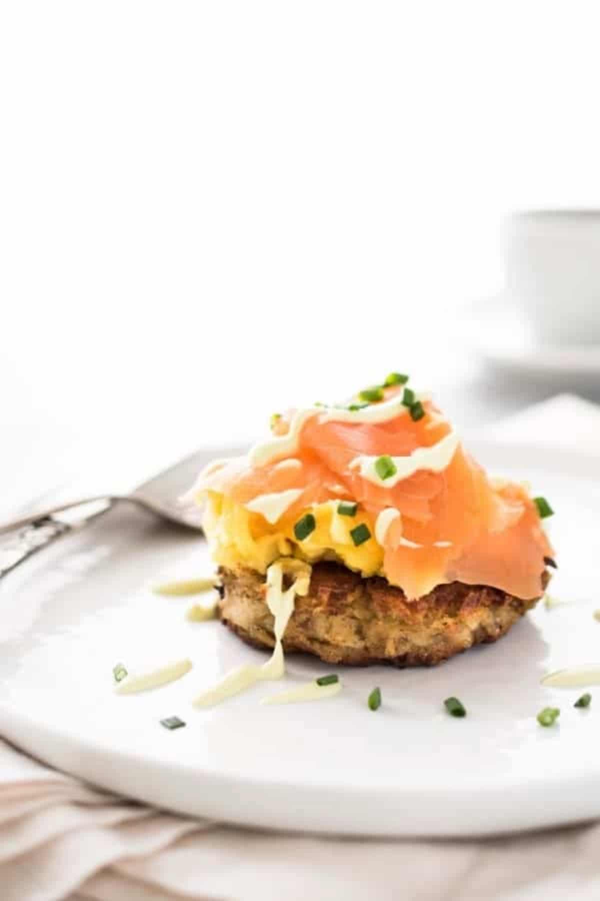 Irish Smoked Salmon and Egg Boxty served on a white plate.