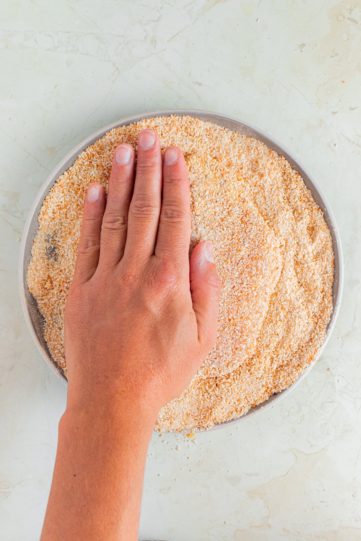 Breading pork chops.