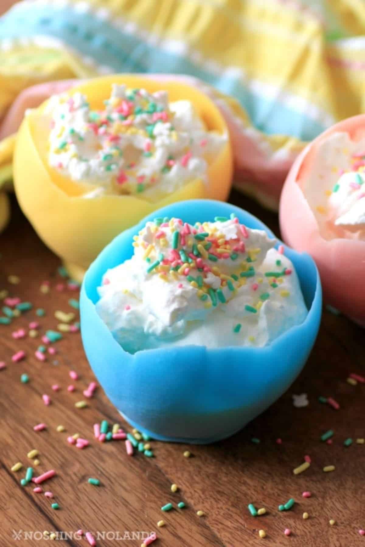 Easter Cups With Lemon Curd in blue bowl, pink bowl and yellow bowl.