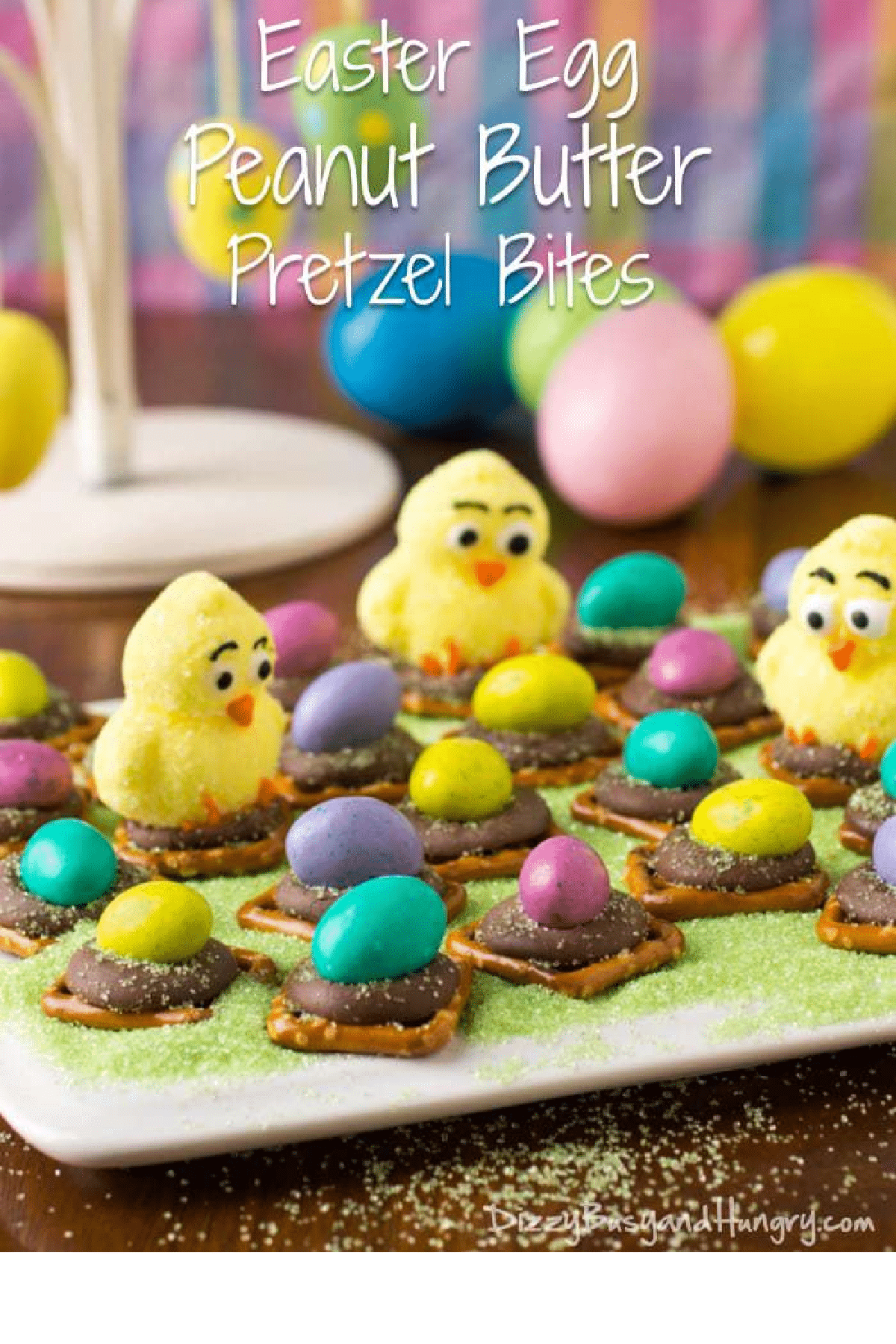 Easter Egg Peanut Butter Pretzel Bites on a plate with toy birds and mini-eggs on top.