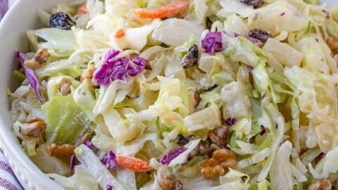 Pineapple Walnut Raisin Coleslaw in a white bowl