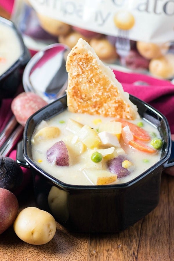 Chicken Pot Pie Soup in a black bowl