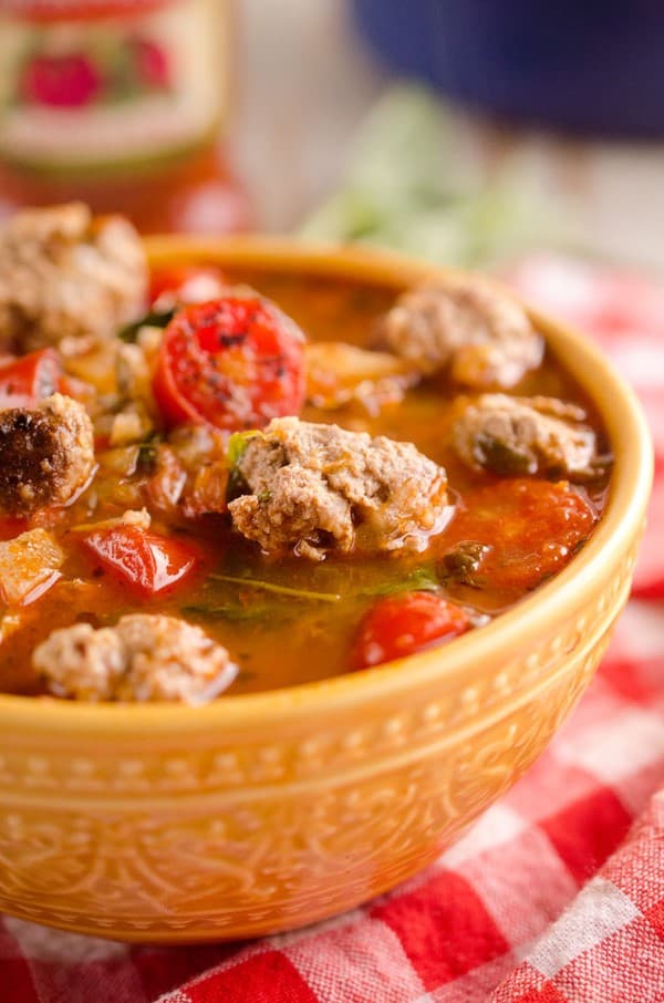 Tomato Basil Meatball Soup in a orange bowl