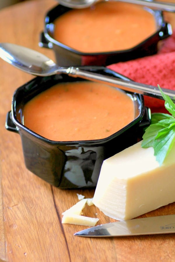 Slow Cooker Tomato Basil Soup in black bowls