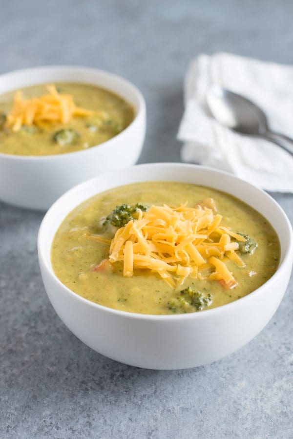 Broccoli and Cheddar Soup in white bowls
