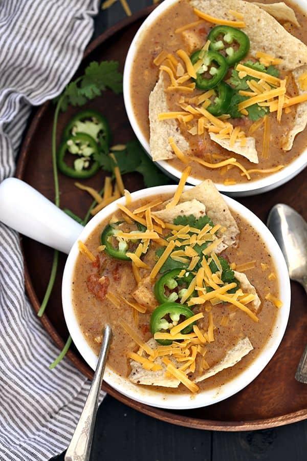 Two Bowls of King Ranch Chicken Soup in white bowls