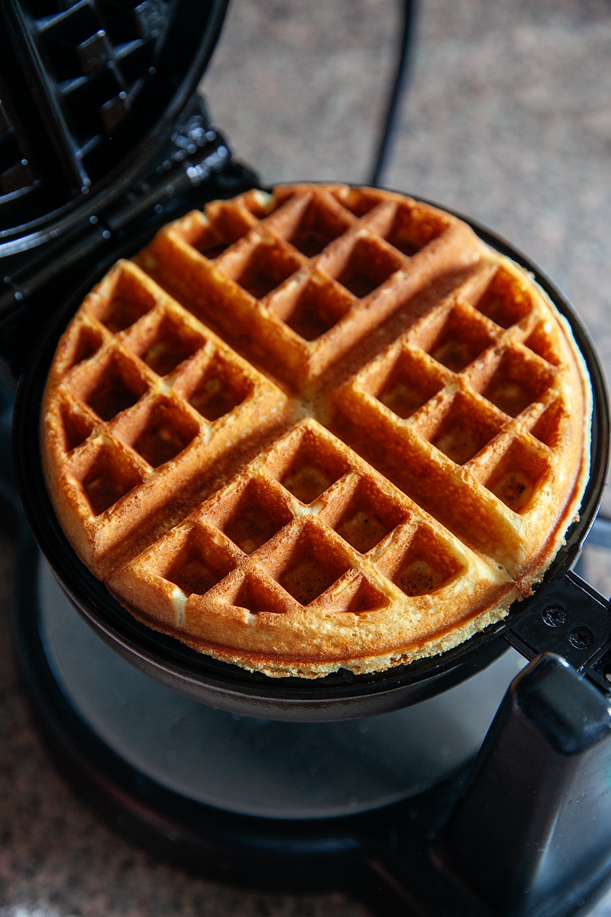 Waffle in a waffle iron. 
