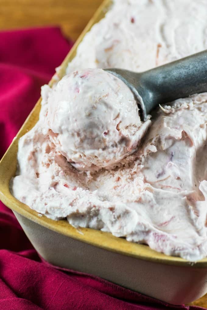 ice cream in a container with a scoop