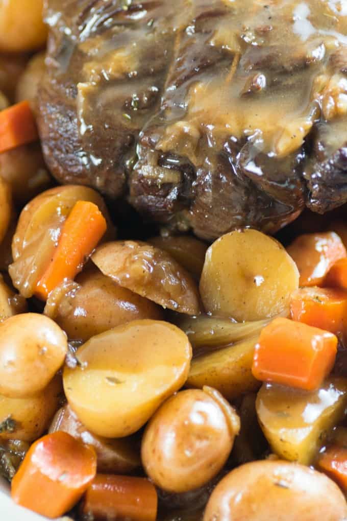 Cooked roast beef with potatoes and carrots with gravy