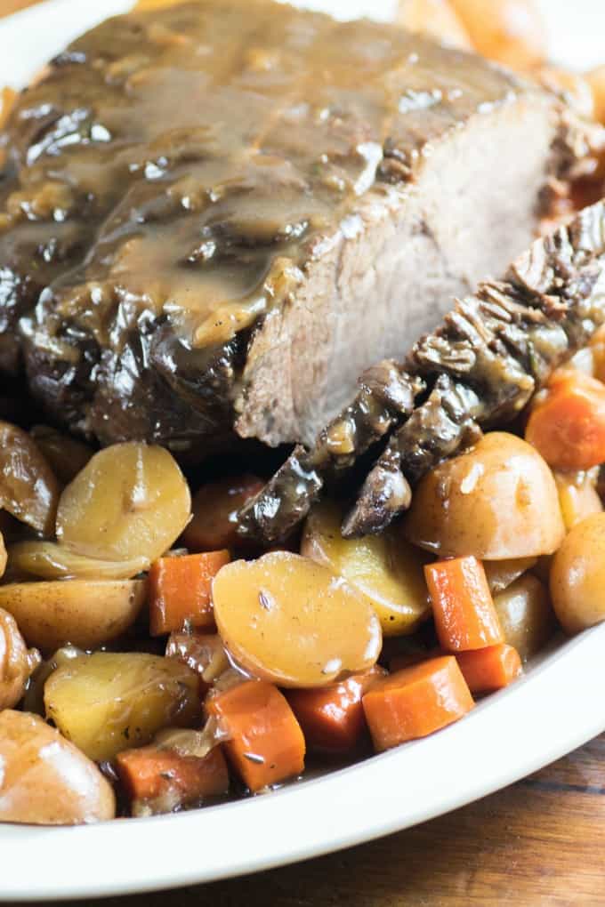 Pressure Cooker Pot Roast on a platter with potatoes and carrots