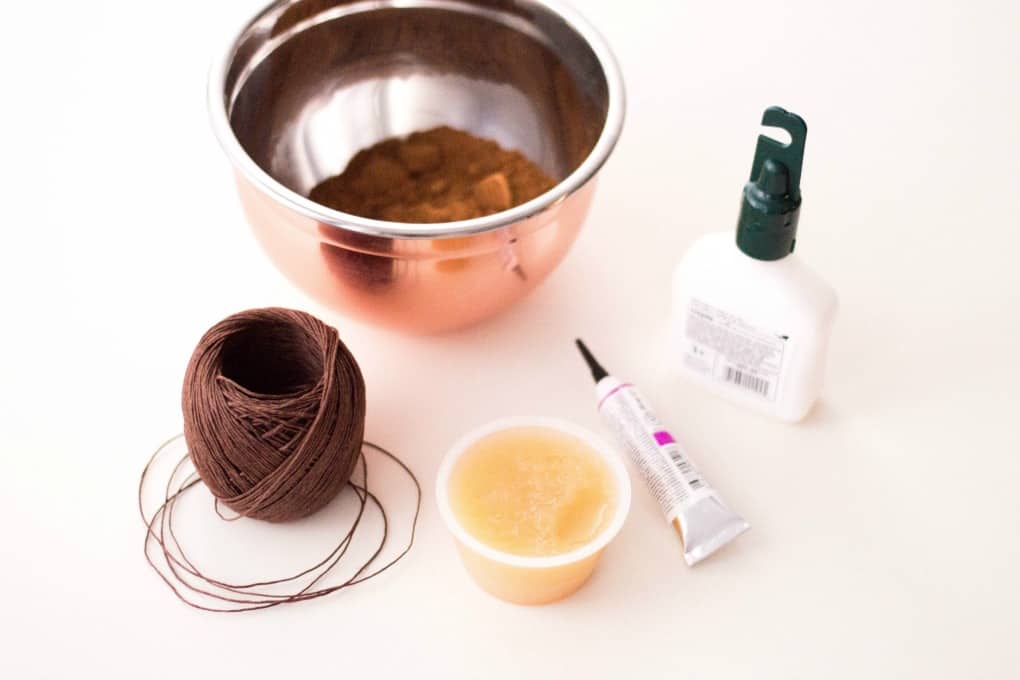 Bowl, twine, applesauce, glue, and paint on a white background