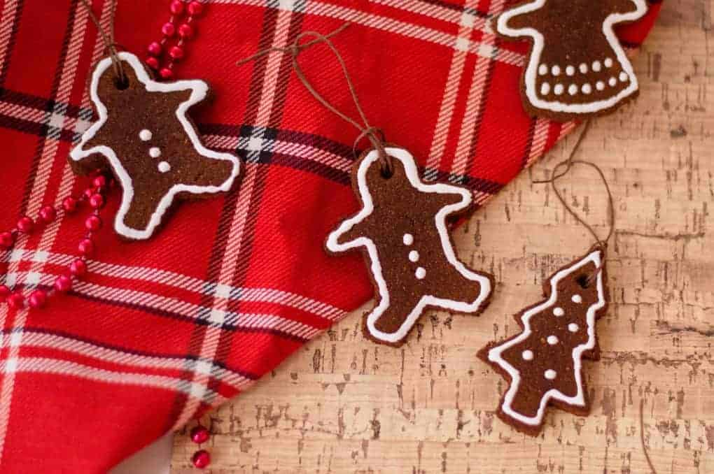 Cinnamon ornaments on a red plaid scarf and cork board