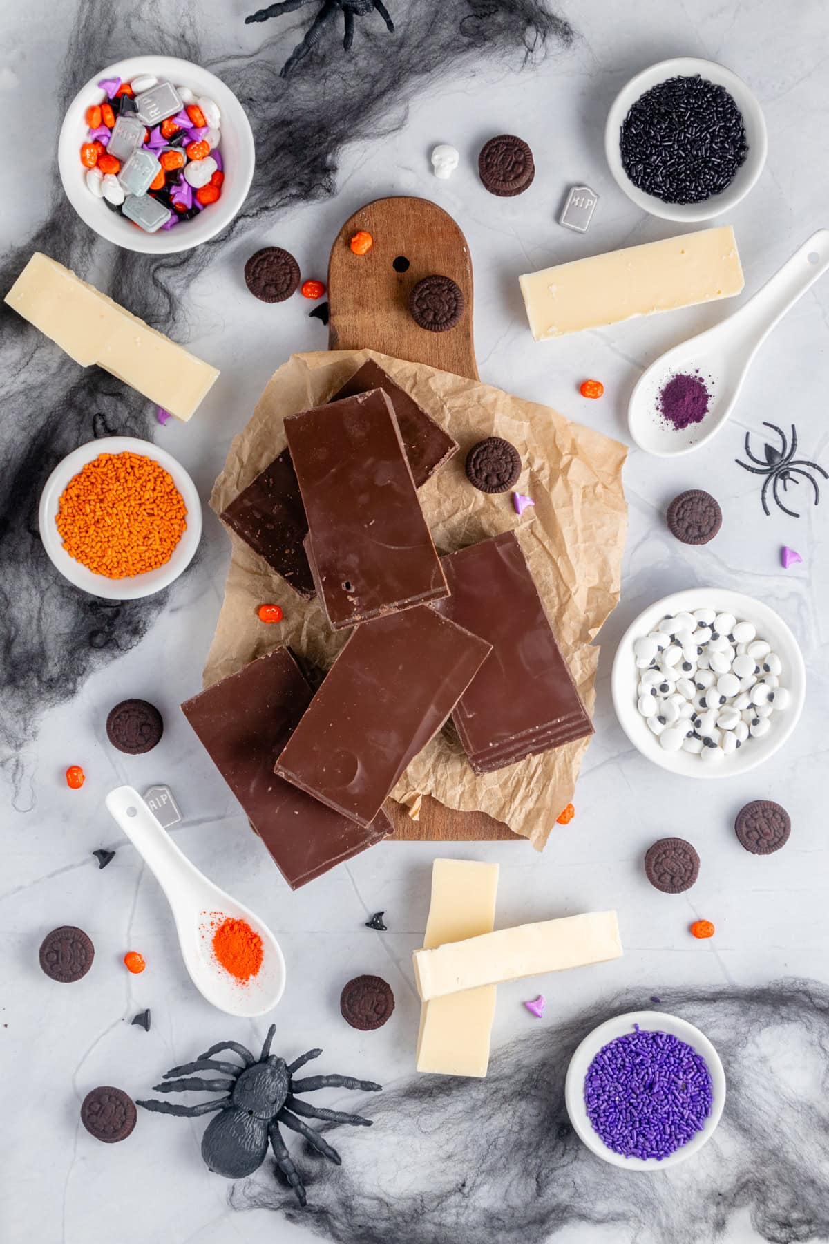 Ingredients for the Halloween Bark over the countertop.