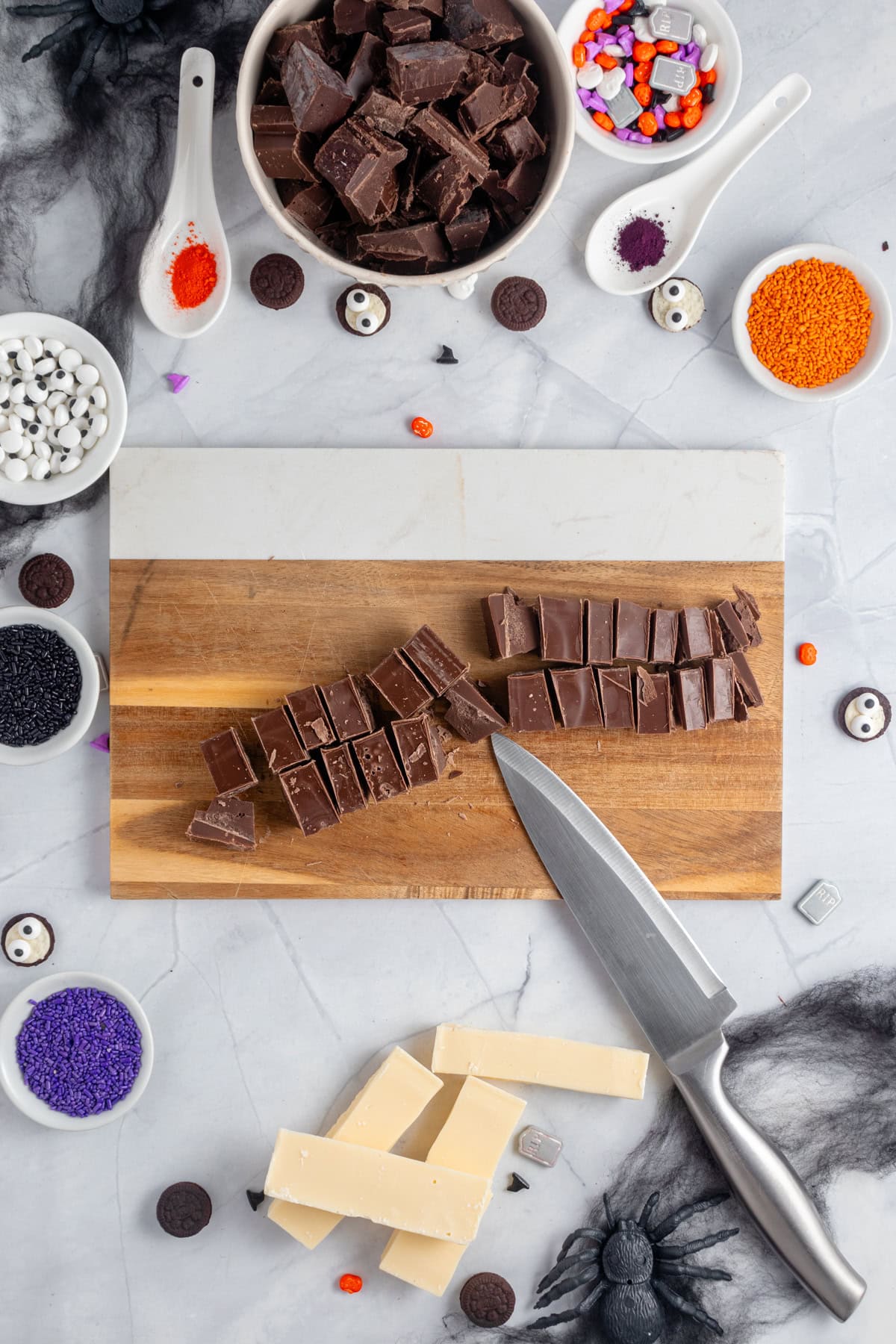 Chopping chocolate on a wooden board.