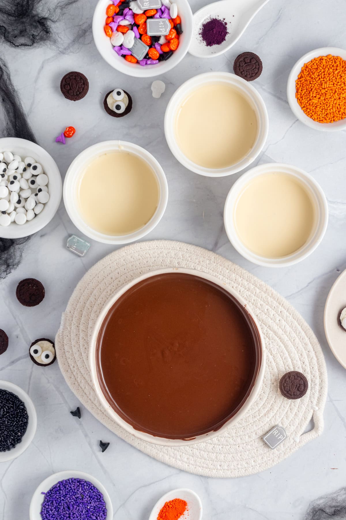 Melted chocolate divided into different bowls.