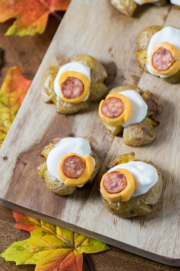 Smashed potatoes with eyeballs made of sour cream, cheese and pepperoni