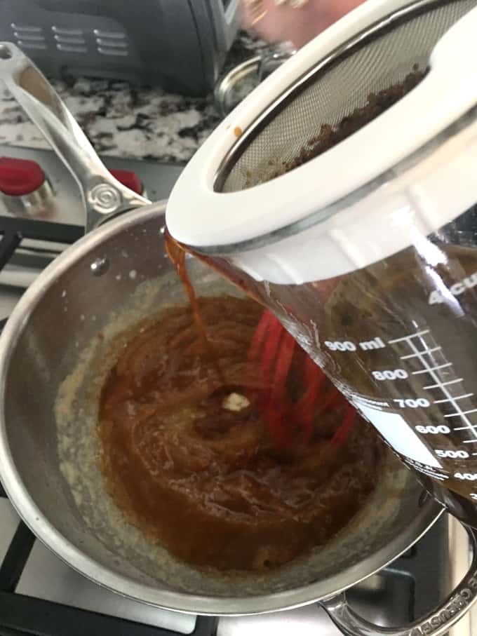 Whisking turkey drippings into a pan