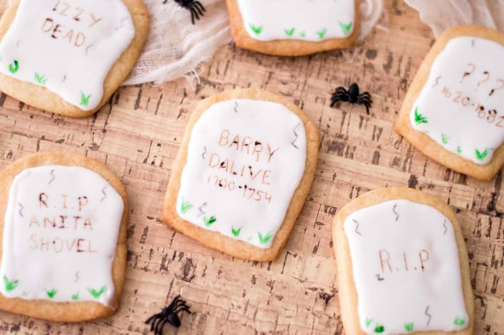 Tombstone cookies on cork with spiders