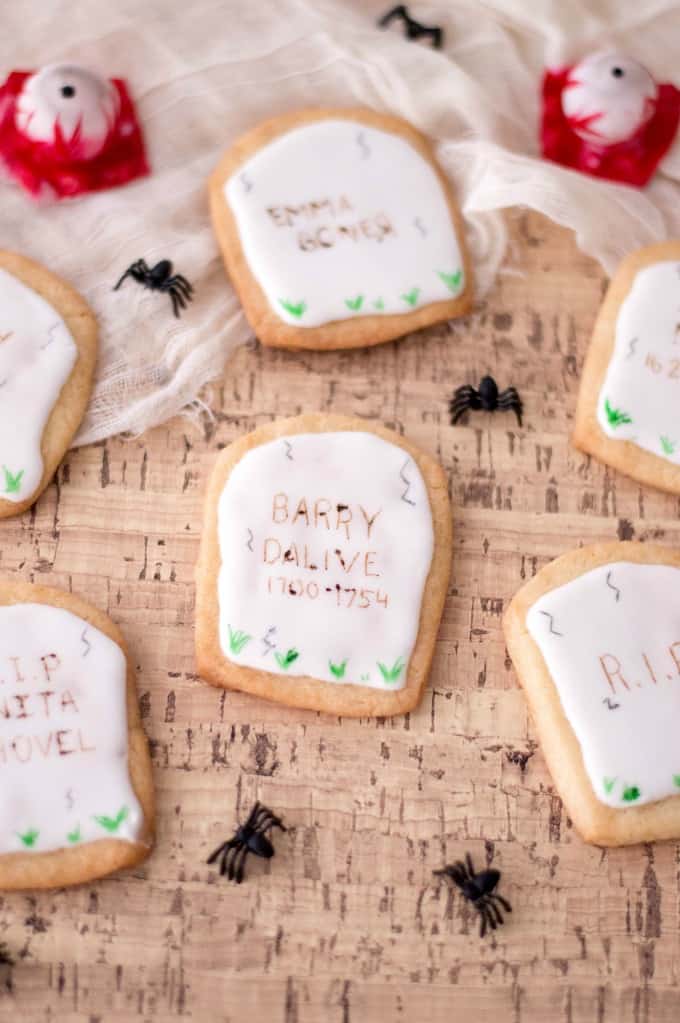 Tombstone cookies on cork with spiders and eyeballs