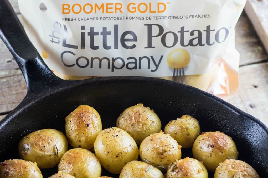 Garlic Rosemary Fondant Potatoes in a cast iron pan