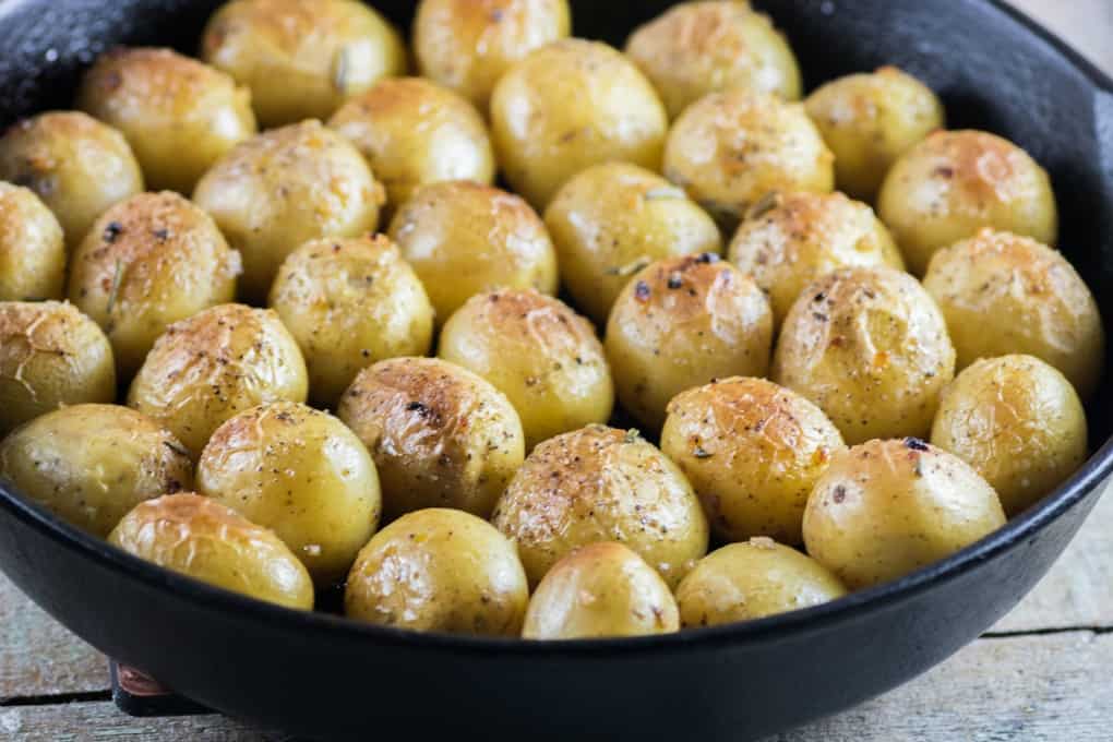 Garlic Rosemary Fondant Potatoes in a cast iron pan