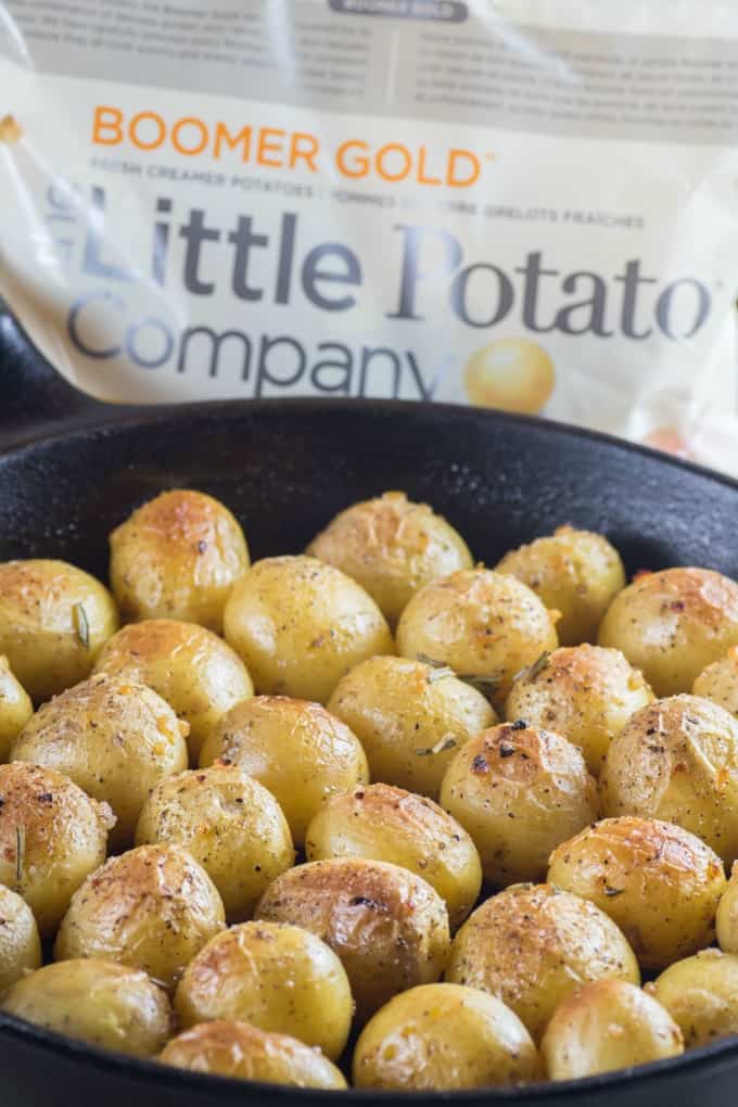 Garlic Rosemary Fondant Potatoes in a cast iron pan