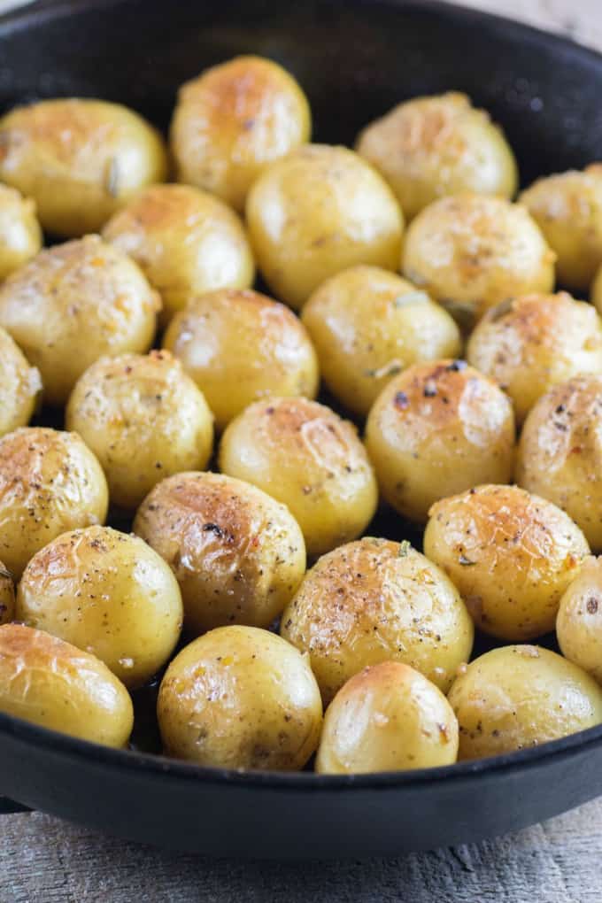 Garlic Rosemary Fondant Potatoes in a cast iron pan