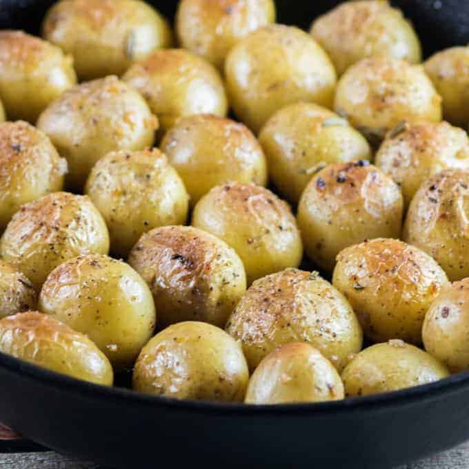 Garlic Rosemary Fondant Potatoes in a cast iron pan