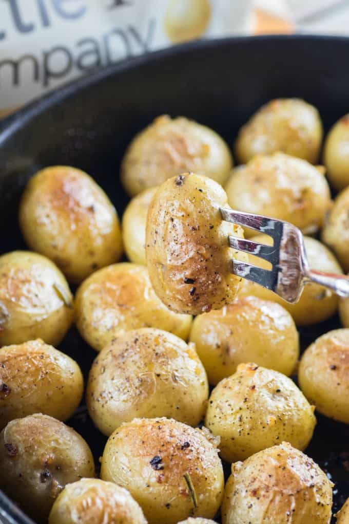 Garlic Rosemary Fondant Potatoes in a cast iron pan