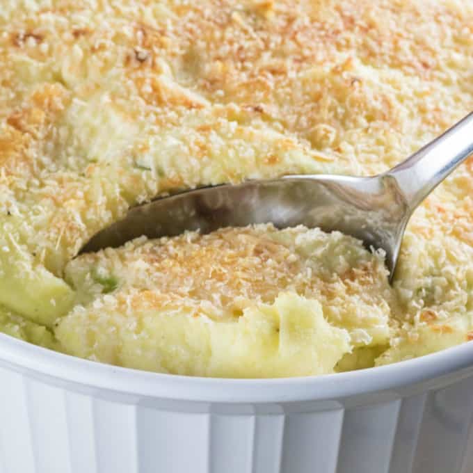 Spooning out Make-Ahead Mashed Potatoes Recipe