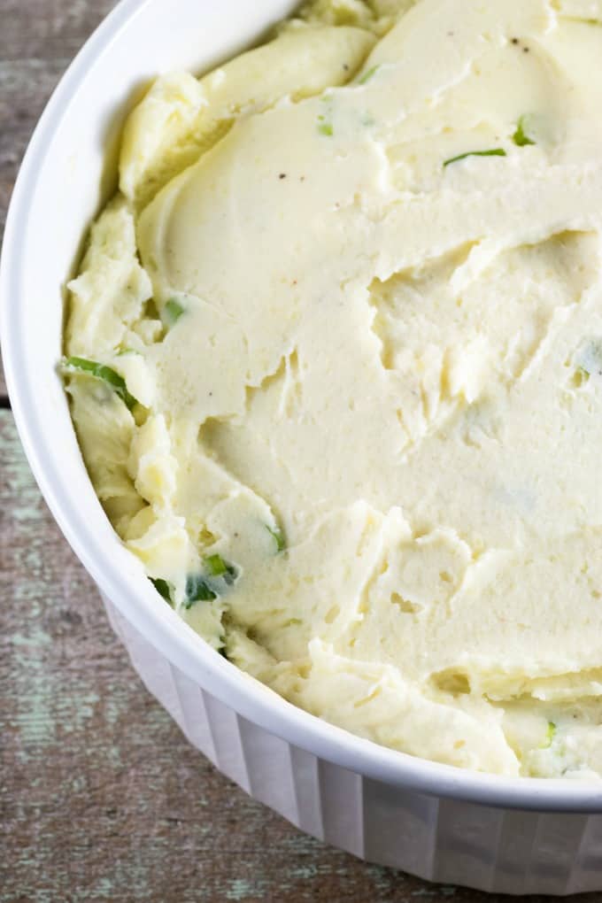 Make-Ahead Mashed Potatoes in a white casserole