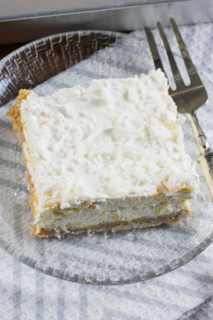 Pineapple Dream Dessert on a glass plate with a fork