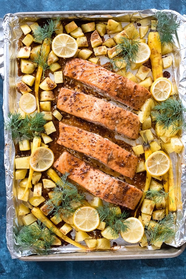 Salmon on a sheet pan with lemon, potatoes and herbs