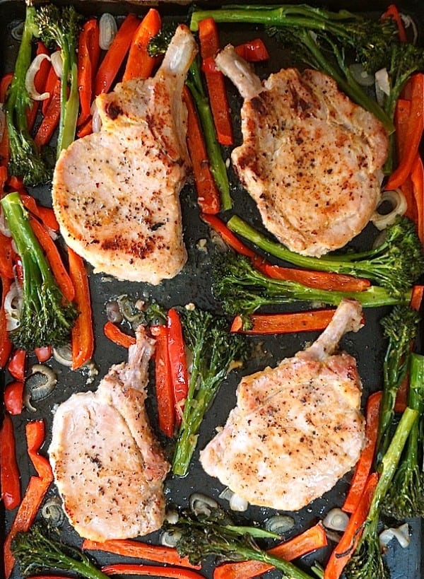 Raosted pork Chops, peppers and broccolini on a sheet pan 