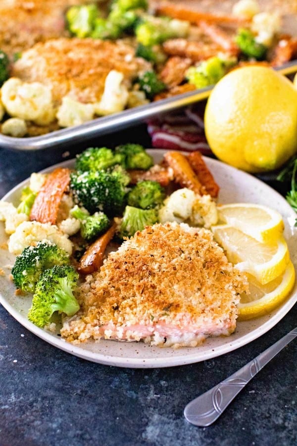 Crusted salmon with vegetables on a plate 