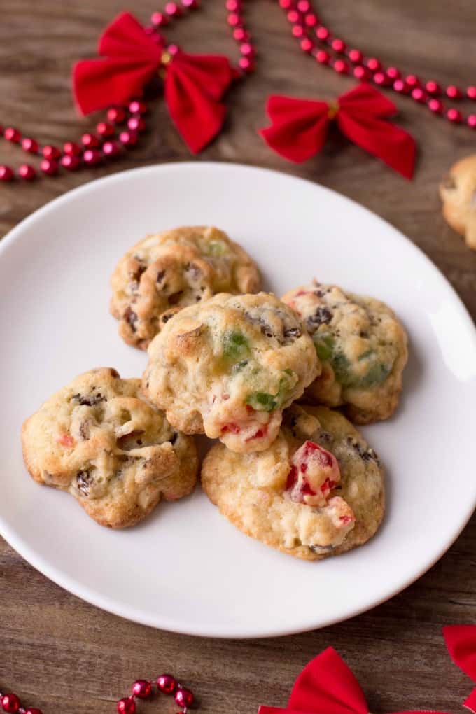 Best Ever Fruitcake Cookies on a white plate with holiday decor. 