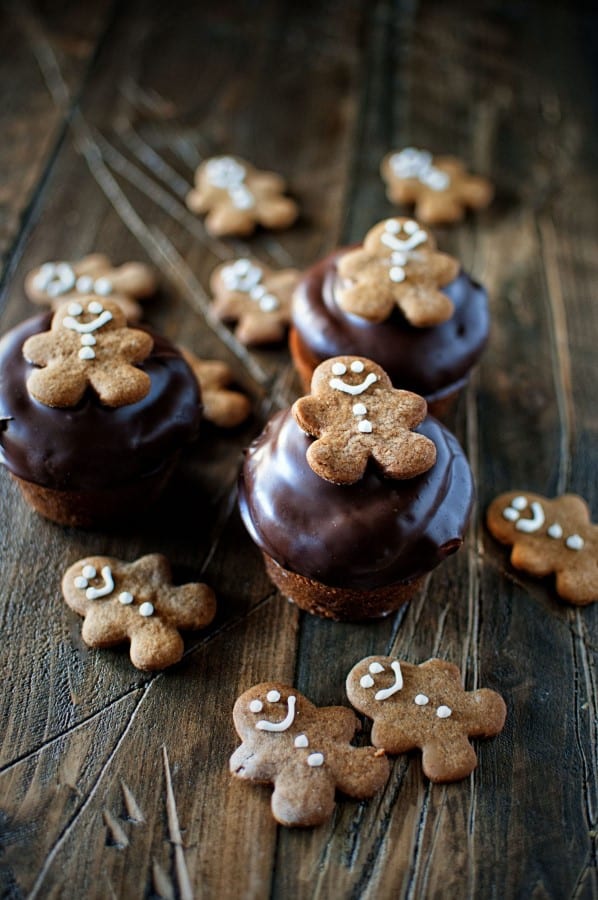 Chocolate Dipped Gingerbread Cupcakes on a wooden board. 