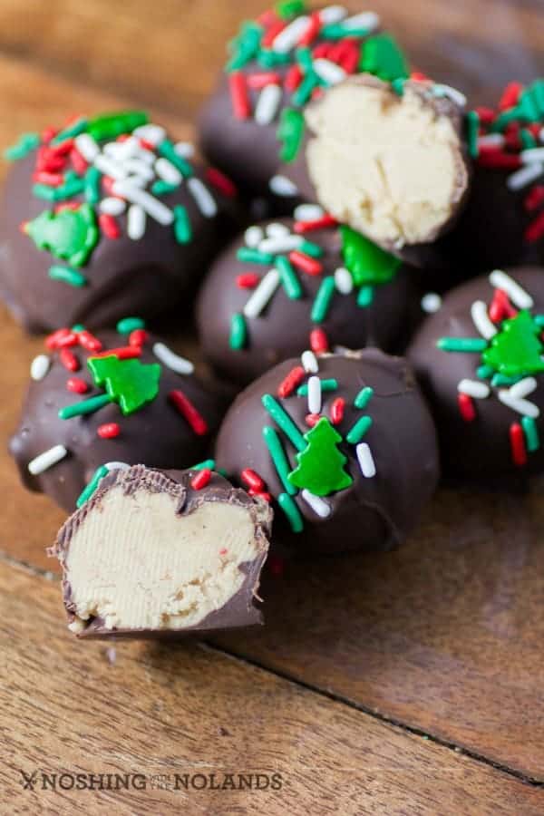 Chocolate Peanut Butter Balls on a wooden board.