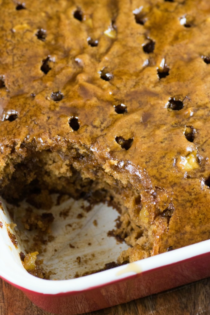 Easy Apple Brandy Sticky Toffee Pudding in a large 9x13" pan with poke holes. 