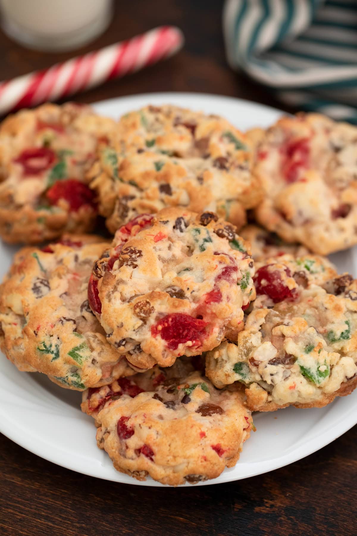 Fruitcake cookies stacked on a plate. 