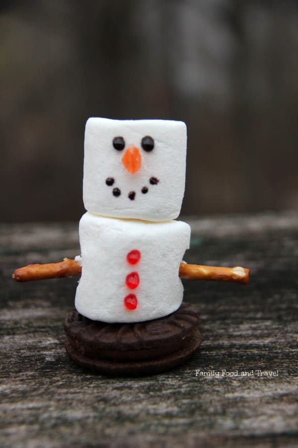 Marshmallow Snowman on a wooden surface. 